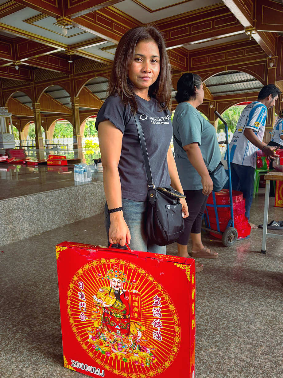 Aom posing with newly purchased firecrackers in Nakhon Si Thammarat