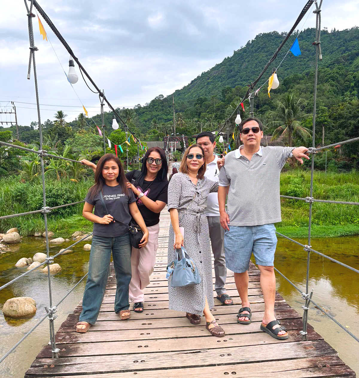 Half the group gathered on Khiriwong Rope Bridge in Lan Saka