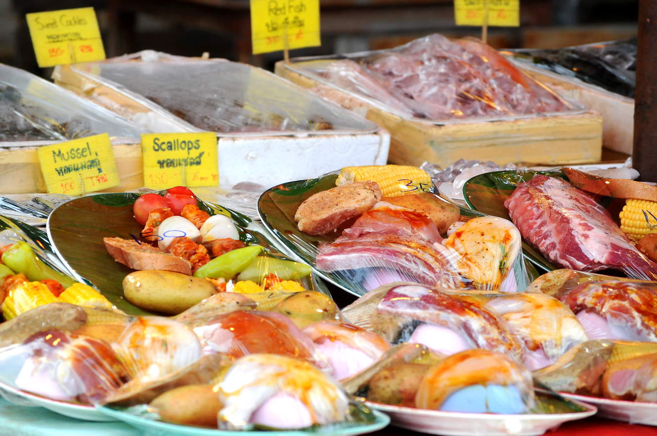 Thai food market with fresh fish, seafood and vegetables A Thai food market with fresh fish, seafood, meat and vegetables