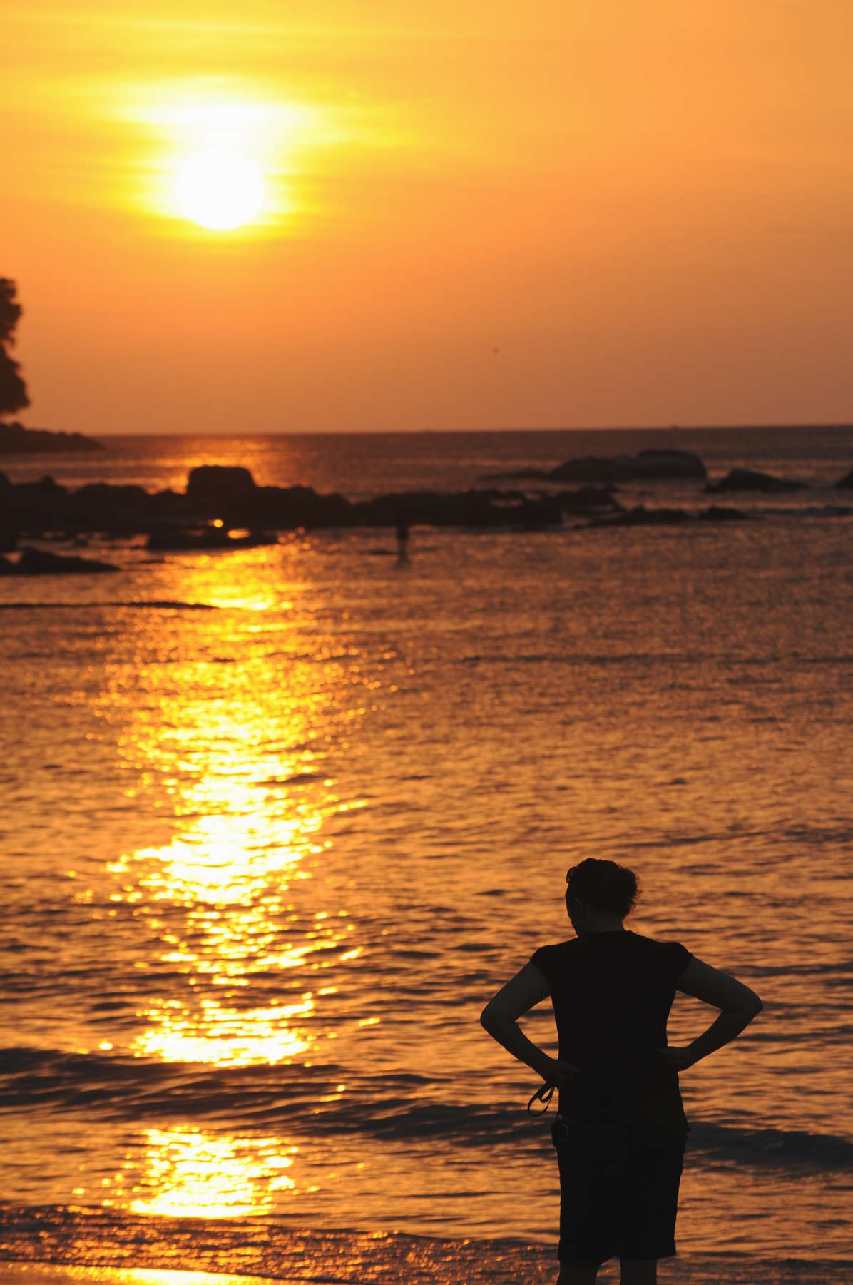 Watching a sunset in Khao Lak Woman watching Khao Lak sunset