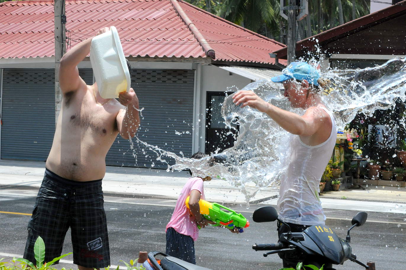 Anders pours water over his brother Henrik during Songkran Anders pours water over his brother Henrik during Songkran on Koh Samui